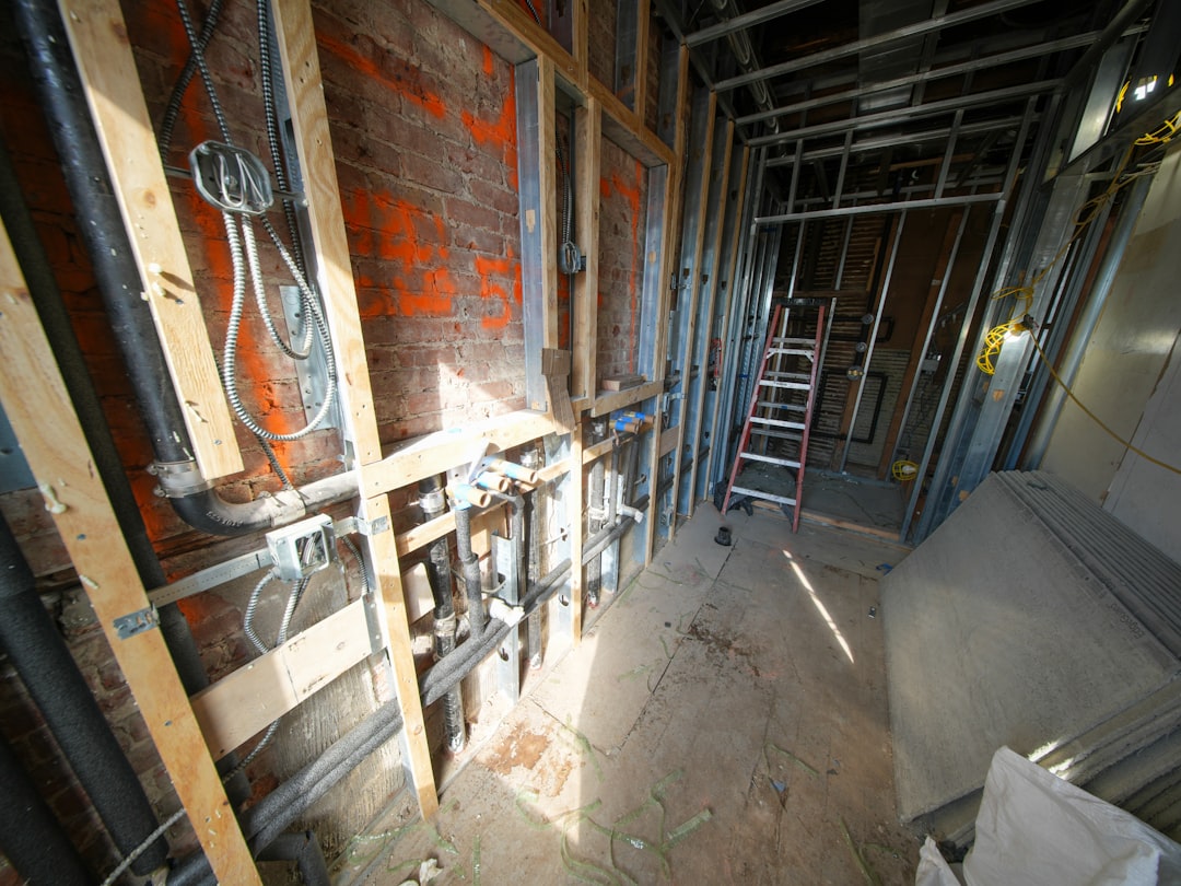 Licensed plumber repairing residential copper piping